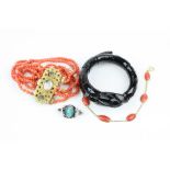 French jet serpent bracelet, a six strand coral bracelet with painted figure to Cannetille style