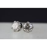 Pair of diamond solitaire stud earrings, each round brilliant cut diamond weighing approx 1.0 carat,