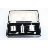 Three piece silver cruet, comprising opensalt cellarm pepper pot, mustart pot, salt and mustard