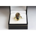 Smoky quartz 9ct yellow gold dress ring, oval mixed cut smokey quartz, rub over setting with flat