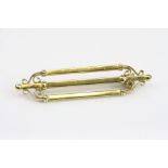 Victorian 15ct yellow gold brooch, three bars with scroll design and bead ends, length approx 4cm