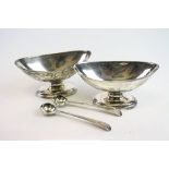 Pair of George III silver marquise open salt cellars raised on pedestal foot, crest to body,