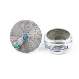 Opal white metal asymmetric ring stamped 950, the circular textured swivel head set with three small