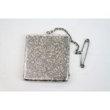 Austrian silver photograph locket, the rectangular case with engraved floral and scroll