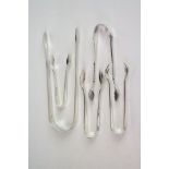 Four pairs of silver sugar tongs, fully hallmarked, together with a white metal pair