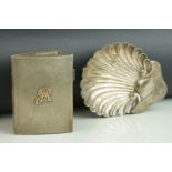 Silver scallop shell shaped ash tray raised on three ball feet, makers George Unite, Brmingham