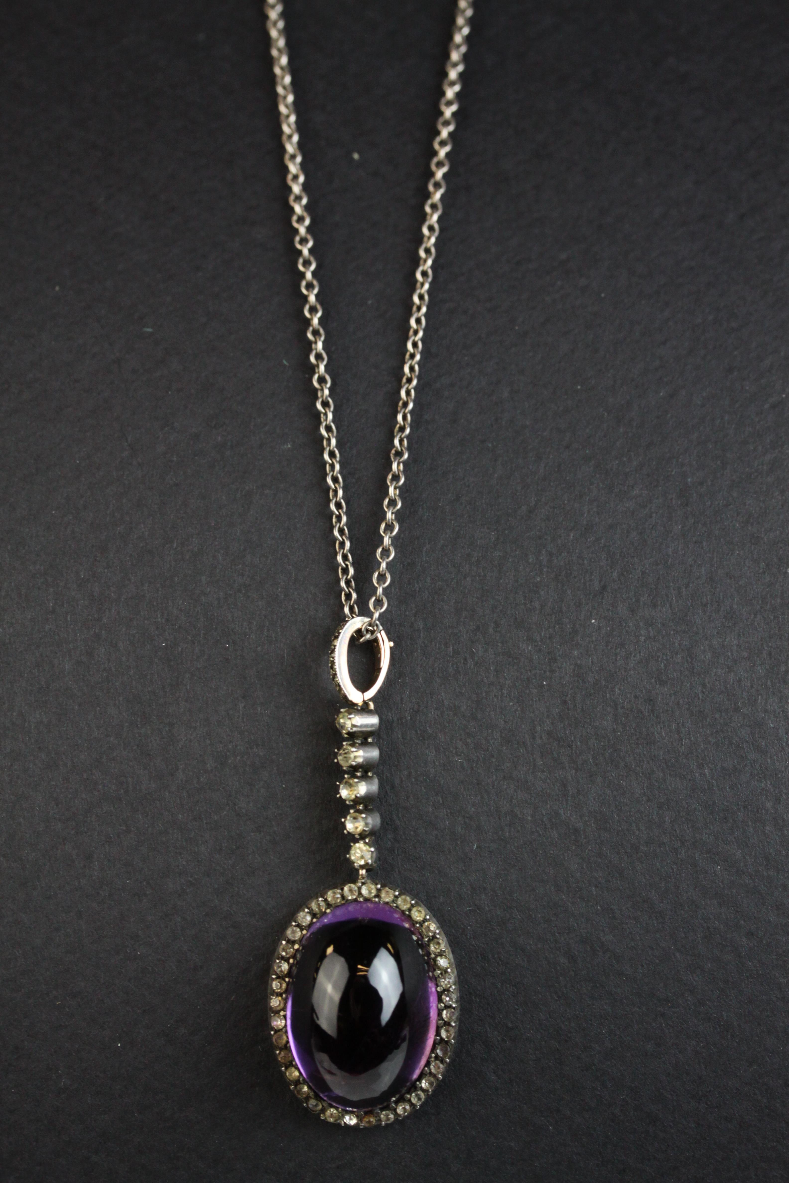 Victorian amethyst and paste silver and gold backed pendant necklace, the oval cabochon cut amethsyt