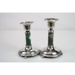 Pair of Edwardian silver and green quart with mica candlesticks, each raised on three bun feet,