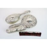 Four piece silver backed dressing table brush set comprising hair brush, hand mirror, comb and