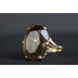 Smoky quartz 9ct yellow gold dress ring, the oval mixed cut smoky quartz measuring approx 20mm x