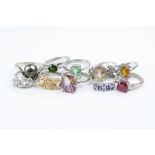 Ten gem set silver rings to include, ruby, prasiolite, green diopside, topaz, ammetrine,