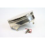 Silver oval jewellery box raised on three cabriole feet, makers Percy James Fish, Birmingham 1919,