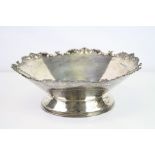 George VI silver pedestal bowl, cast foliate scroll decoration to ogee style border in relief,