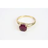 Ruby 14ct yellow gold solitaire ring, four claw setting, textured shoulders, ring size P½