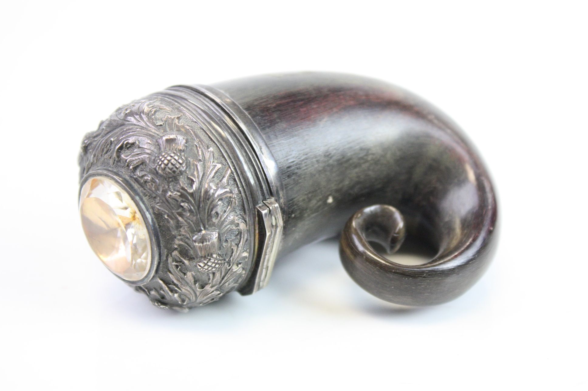 Scottish snuff mull, the hinged white metal cover with repousse repeating thistle decoration and