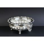 German silver centrepiece bowl raised on four claw and ball feet, the bulbous body with two lion