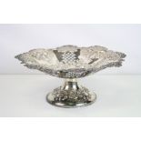 Silver pierced pedestal dish, repousse pineapple, hazelnut and floral decoration, shell and scroll
