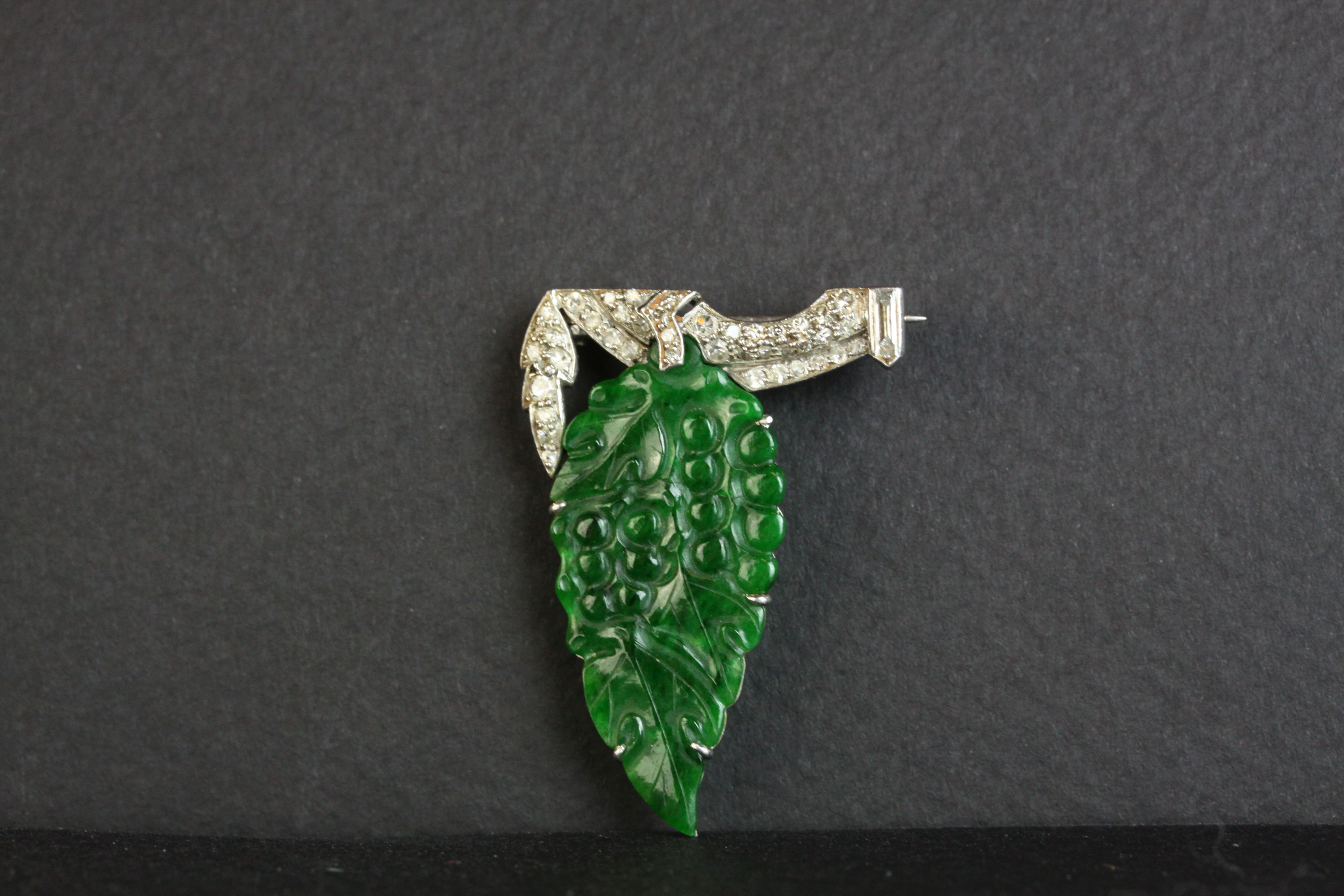 Art Deco jade type and diamond white metal brooch, carved grape and leaf design with small round - Image 3 of 3