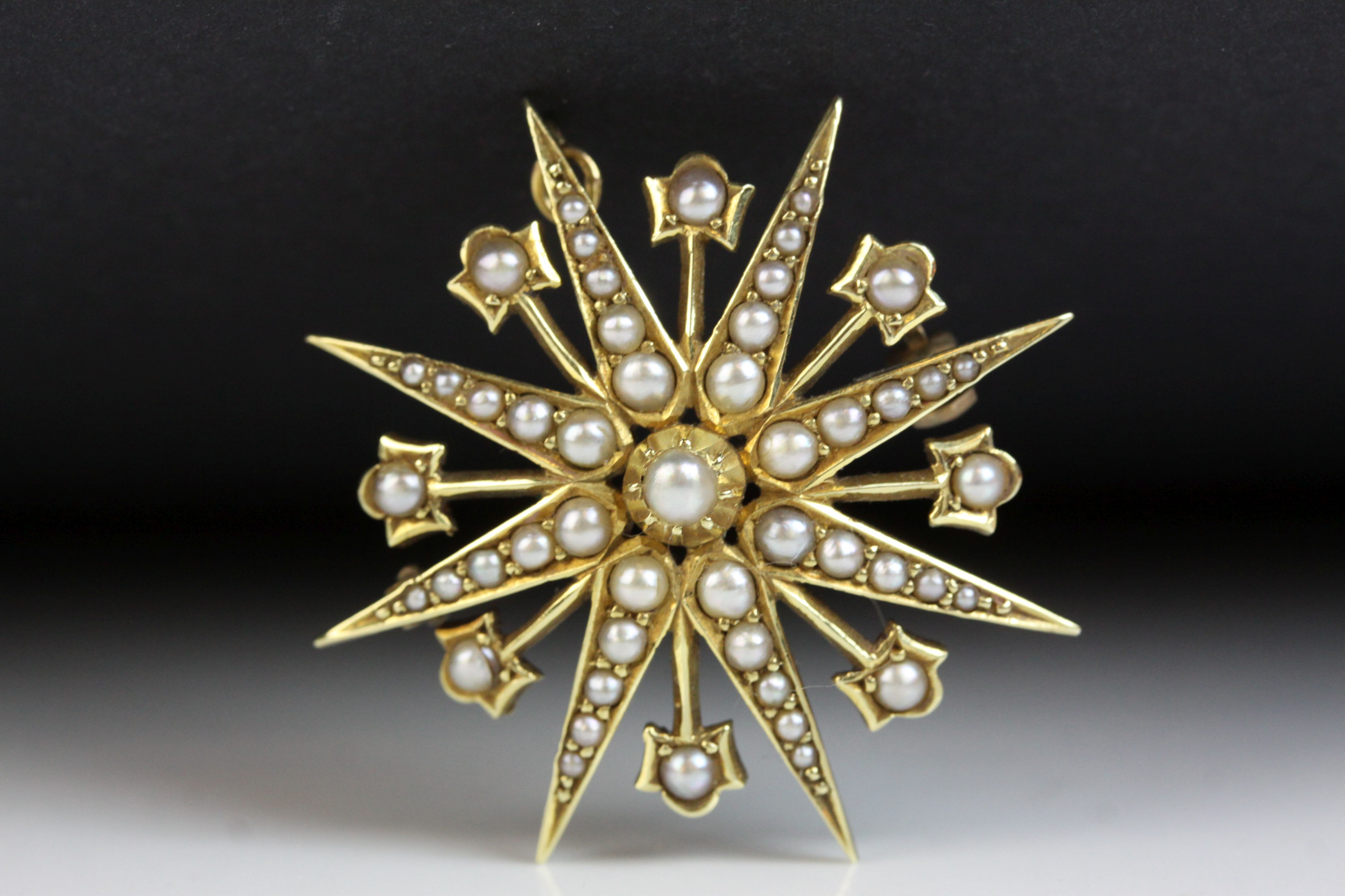 Edwardian seed pearl 15ct yellow gold pendant brooch, eight pronged star full set with graduated