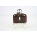 Edwardian silver and crocodile leather mounted glass hip flask, the silver cap with bayonet