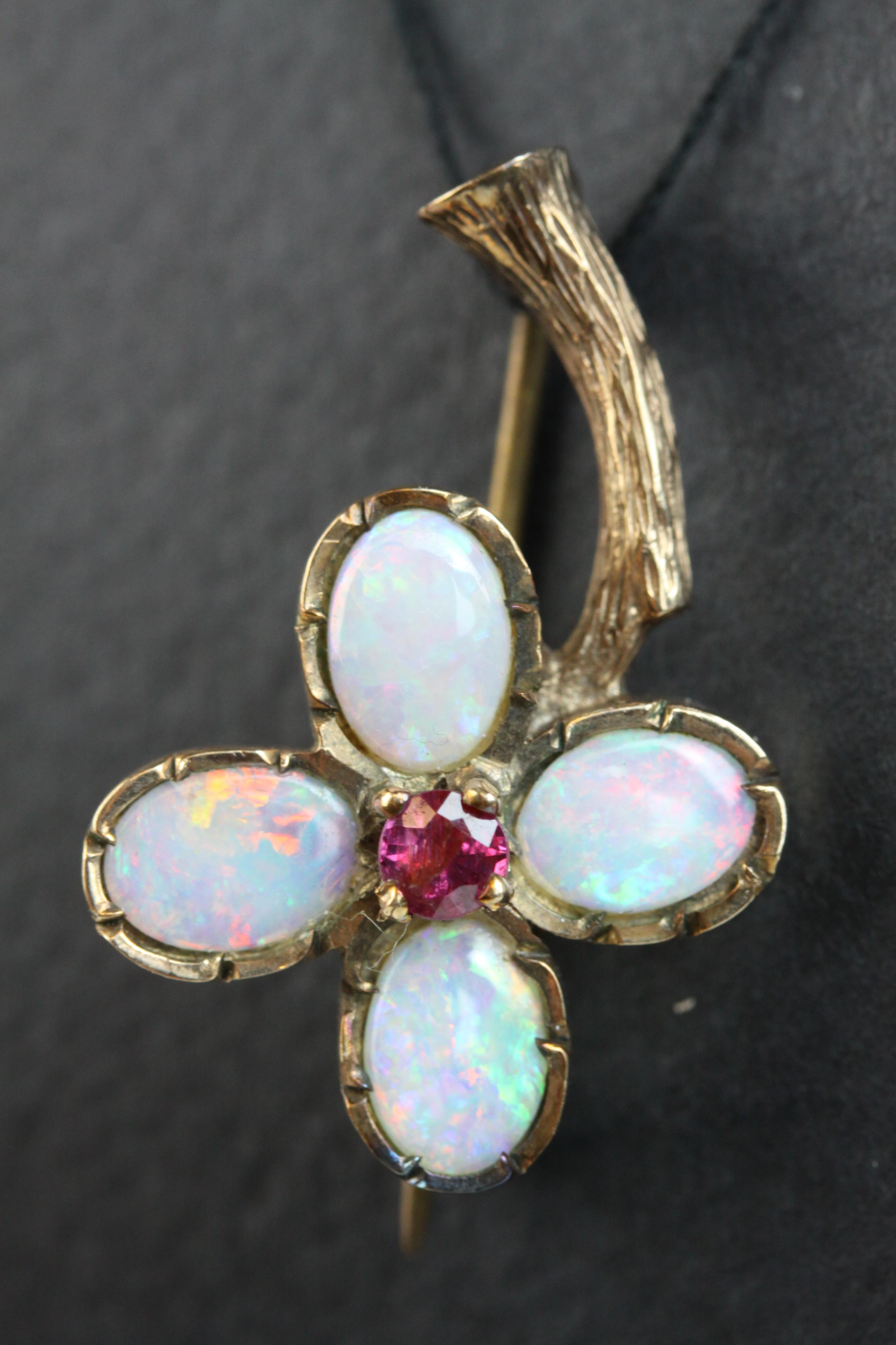 Victorian opal and ruby 9ct rose gold flower head brooch, the flower head formed of four oval