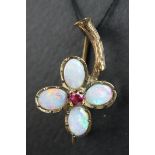 Victorian opal and ruby 9ct rose gold flower head brooch, the flower head formed of four oval