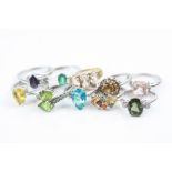 Ten gem set silver dress rings to include morganite, tanzanite, diopside, blue topaz, orange