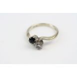 Diamond and sapphire 18ct white gold crossover ring, round mixed cut blue-black sapphire, round