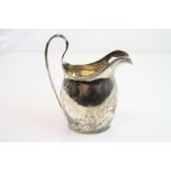 Edwardian silver helmet shaped milk jug, plain polished form, makers mark partially rubbed,