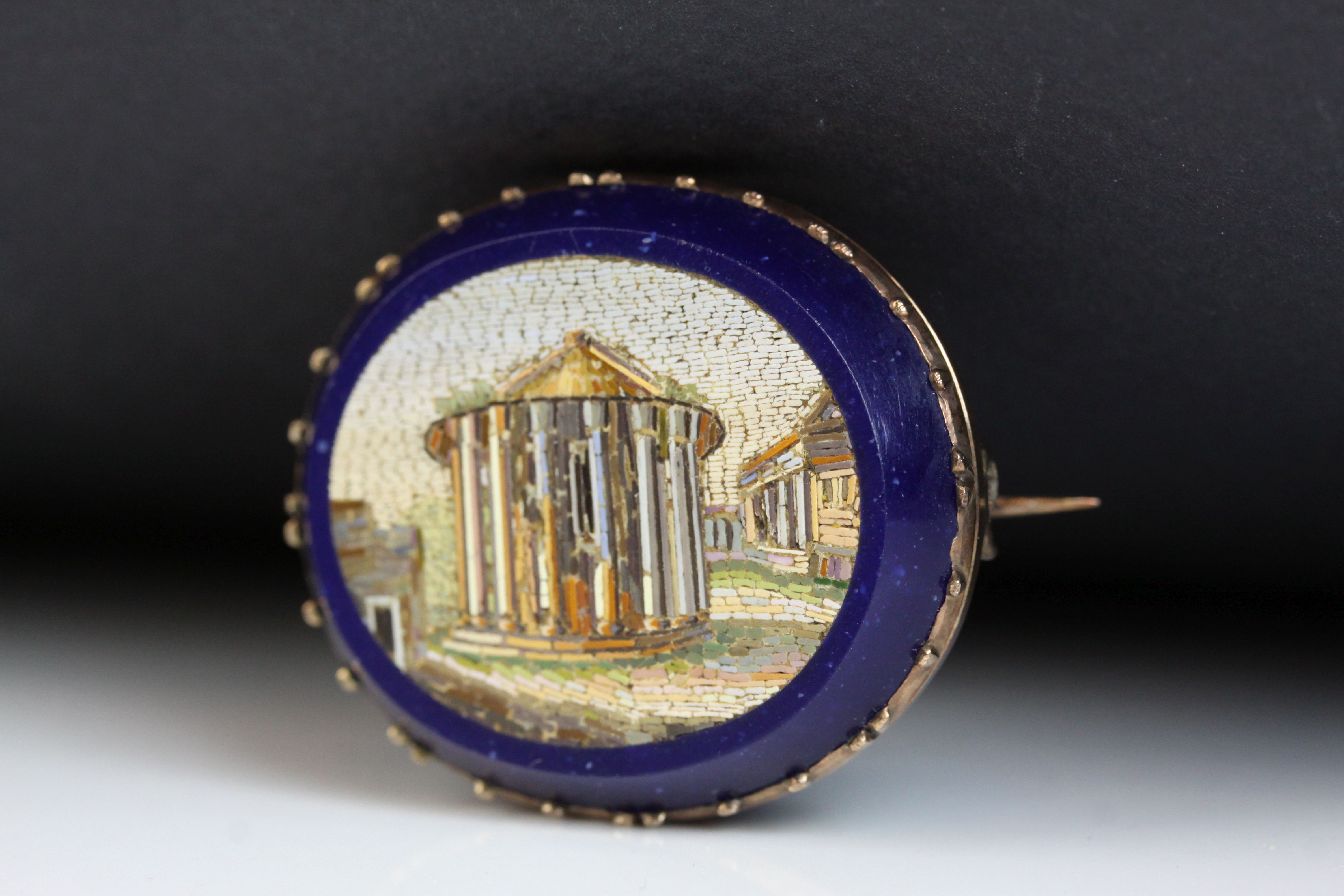 Victorian Grand Tour micro-mosaic oval brooch, the scene depicting a Roman building, yellow metal