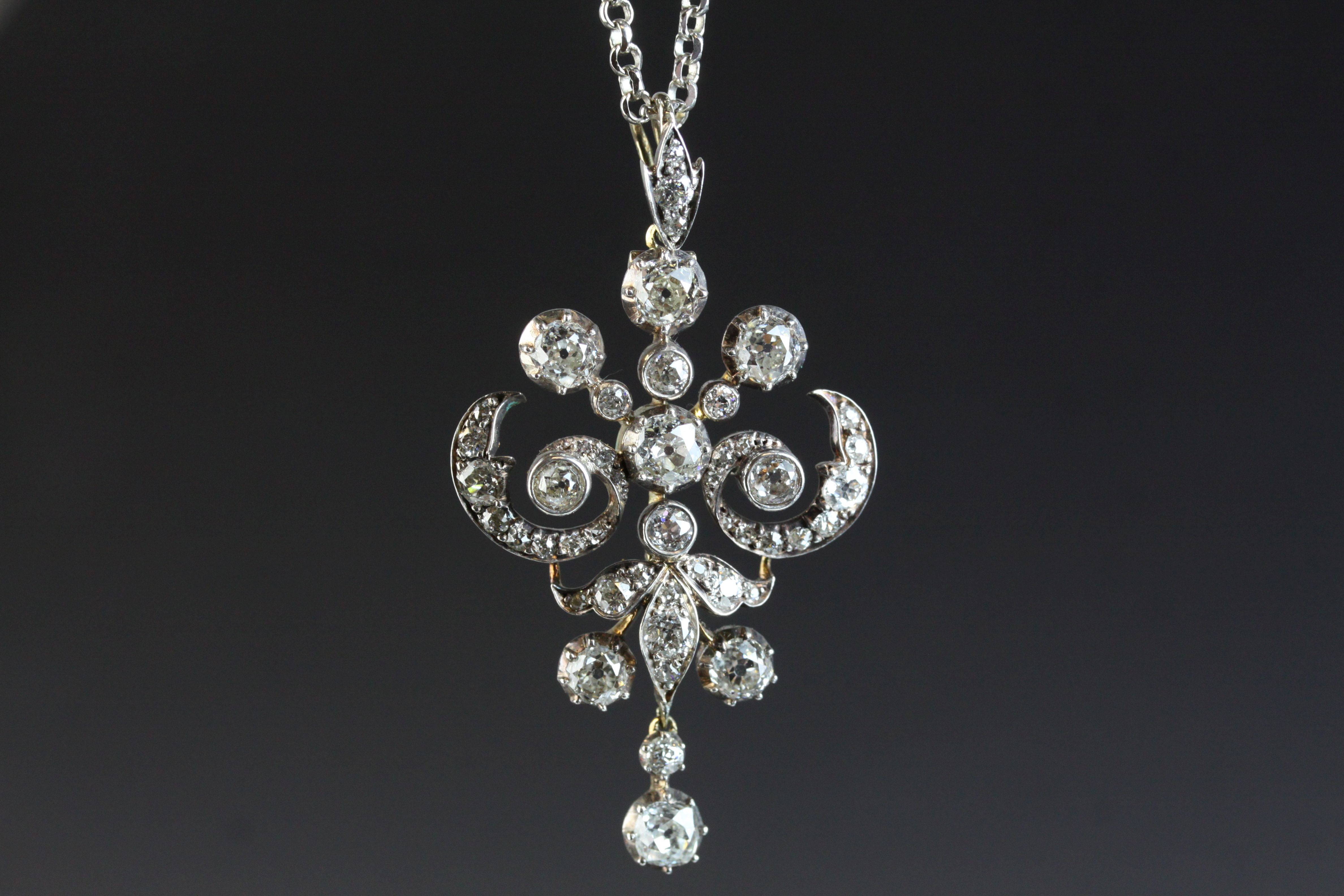 Victorian diamond pendant necklace with dropper, scroll design, the principle old round brilliant