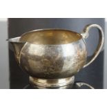 Edward VIII silver milk jug, plain polished squat form, sparrow beak, makers Brook & Son,