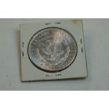 A United States Of America 1899 silver Morgan Dollar without mint mark.