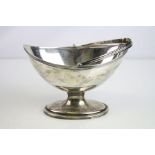 George III silver oval swing handled sugar basket raised on oval foot, pin-prick and reeded