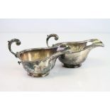 Pair of silver sauce boats, plain polished body, scroll handle with cast acanthus leaf, retailed