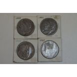 Four United States Of America silver Morgan Dollar coins to include dates 1887, 1882, 1883 and 1878,