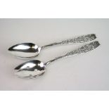 Pair of silver salad servers, berry and floral decoration, stamped sterling with makers marks,