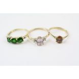 Green diopside 10ct yellow gold three stone dress ring, ring size L½; a morganite diamond 10ct dress