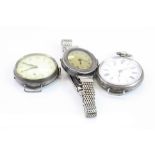 Two silver cased wristwatches, together with a silver cased fob watch with strap attachment (3)