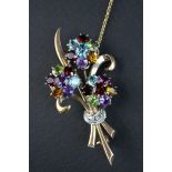 Multi-gemstone 9ct yellow and white gold floral spray brooch, the flower heads set with amethyst,