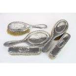 Edwardian five piece silver dressing table brush set comprising two hair brushes, two clothes