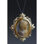 Tiger's eye cameo 9ct yellow gold cameo pendant, the carved tiger's eye depicting a female