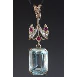 Topaz, ruby and white sapphire yellow gold pendant, the large rectangular blue topaz measuring