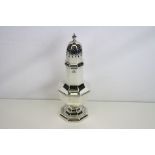 George V silver sugar caster of baluster octagonal form, octagonal foot, turned finial, makers