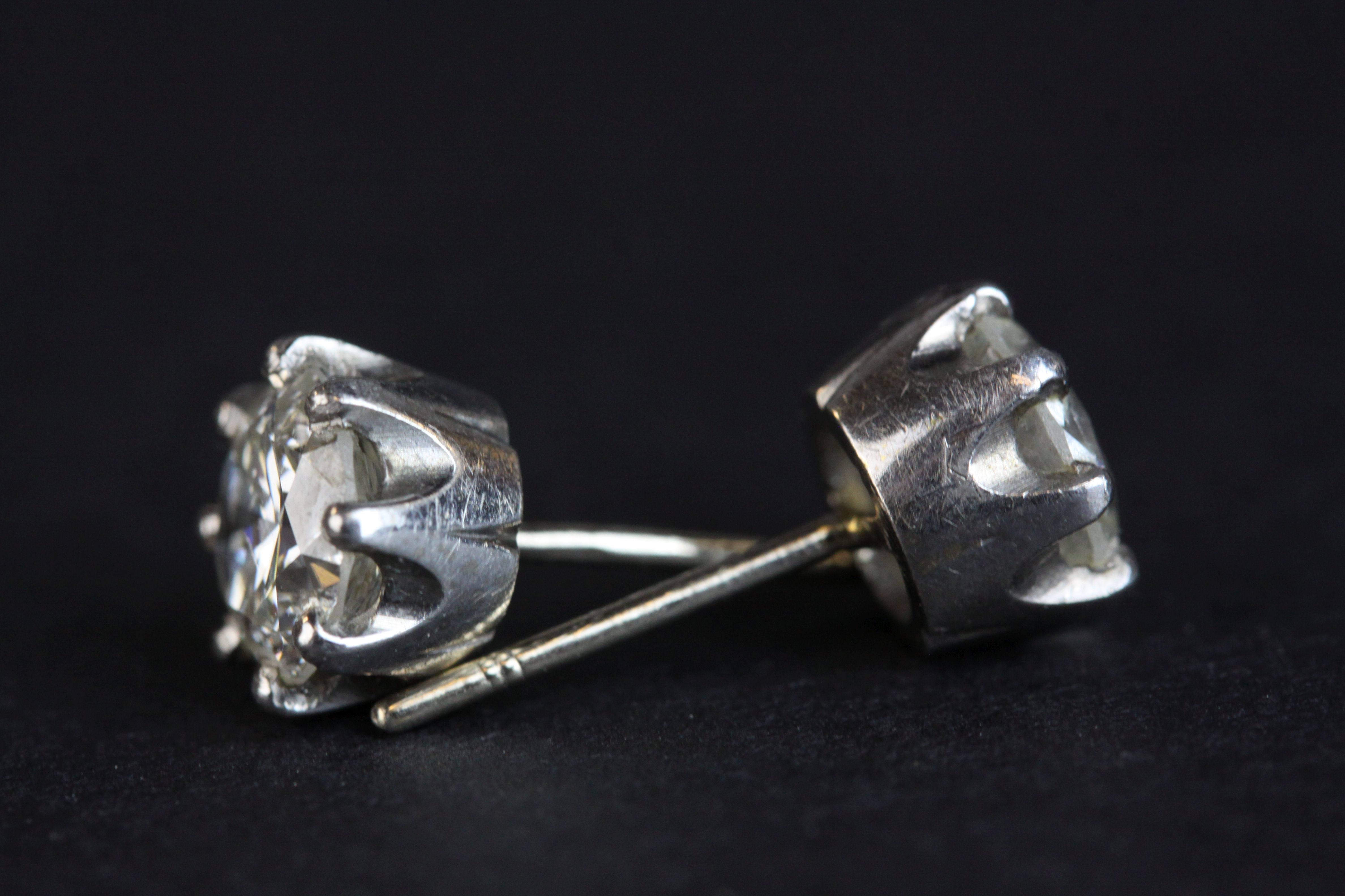 Pair of diamond solitaire stud earrings, each round brilliant cut diamond weighing approx 1.0 carat, - Image 6 of 8