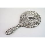 Silver backed hand mirror, mask, bird, floral and foliate scroll decoration, makers Boots Pure