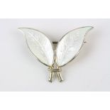 Willy Winnaess for David Andersen: a Norwegian white enamelled silver gilt double leaf brooch,