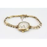 Ladies' gold-plated wristwatch with 9ct yellow gold spring link bracelet strap