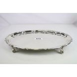 Early 20th century silver oval salver raised on four claw and ball feet, plain polished, Chippendale