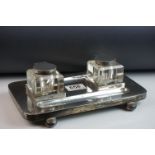 Edwardian silver partners inkwell and pen stand, the rectangular stand raised on fur bun feet,